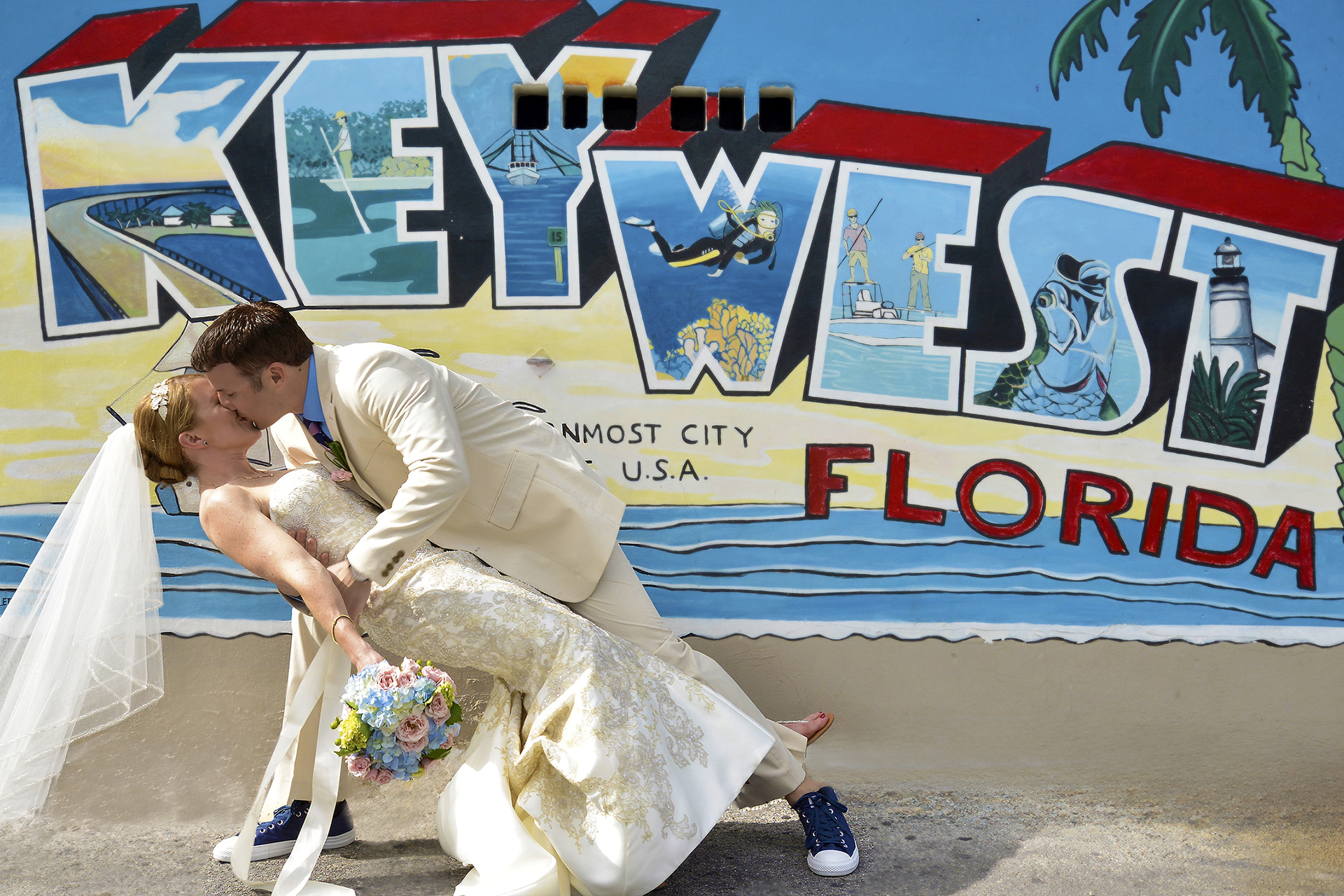 Couple kissing in front of Key West Florida mural